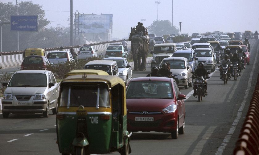 Elephant, motorcyles, pedicabs and cars jostle for space in rush hour in New Delhi, February 1, 2012, file photo. More than half of the worldu00e2u20acu2122s seven billion people live in urban areas, with New Delhi one of the top 10 u00e2u20acu02dcmega citiesu00e2u20acu2122 Reuters