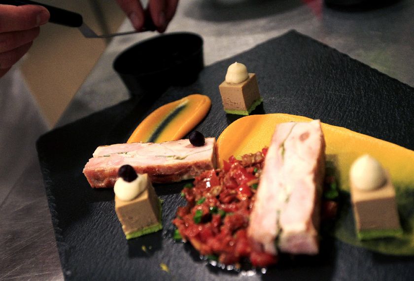 The pressed leg of hare with duck liver cake being put together in the kitchen of Borkonyha.