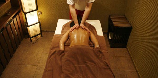 Massage therapy is one remedy that can help reduce back pain Reuters