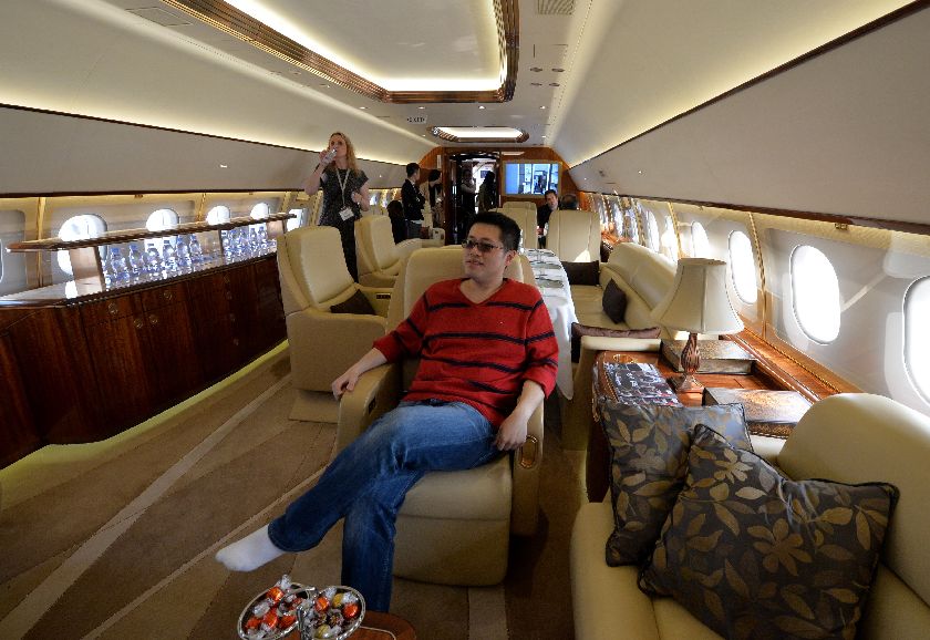 A Chinese businessman checking out an Airbus private business jet at the Asian Business Aviation Conference and Exhibition (ABACE2014) at the Shanghai Hongqiao airport. AFP-Relaxnews