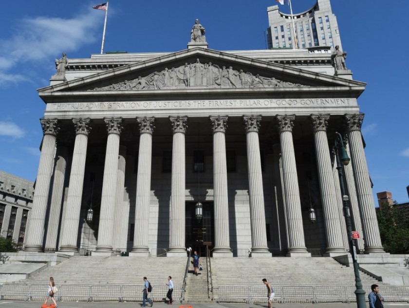 People walk out of the Manhattan Supreme Court building June 30, 2014 after a hearing in which BNP Paribas struck a deal with US prosecutors that would see the French bank pay a fine of US$8.9 billion for violating US sanctions. u00e2u20acu201d AFP pic