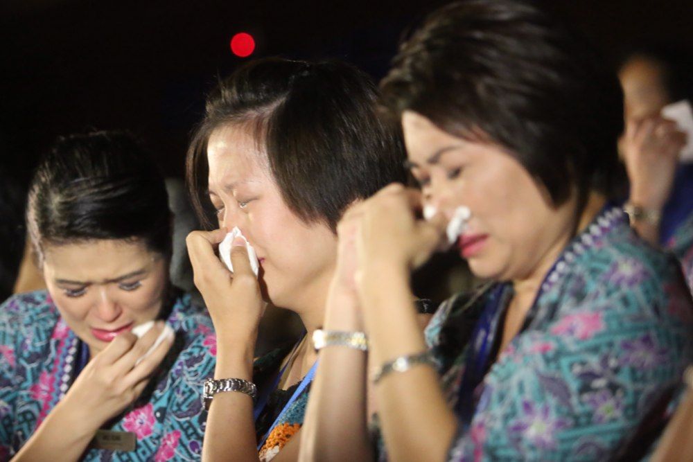 MAS stewardess cry at the multi-faith prayer service for passengers and crew of MH17 at Malaysia Airlines Academy, Kelana Jaya. u00e2u20acu201d Picture by Choo Choy May