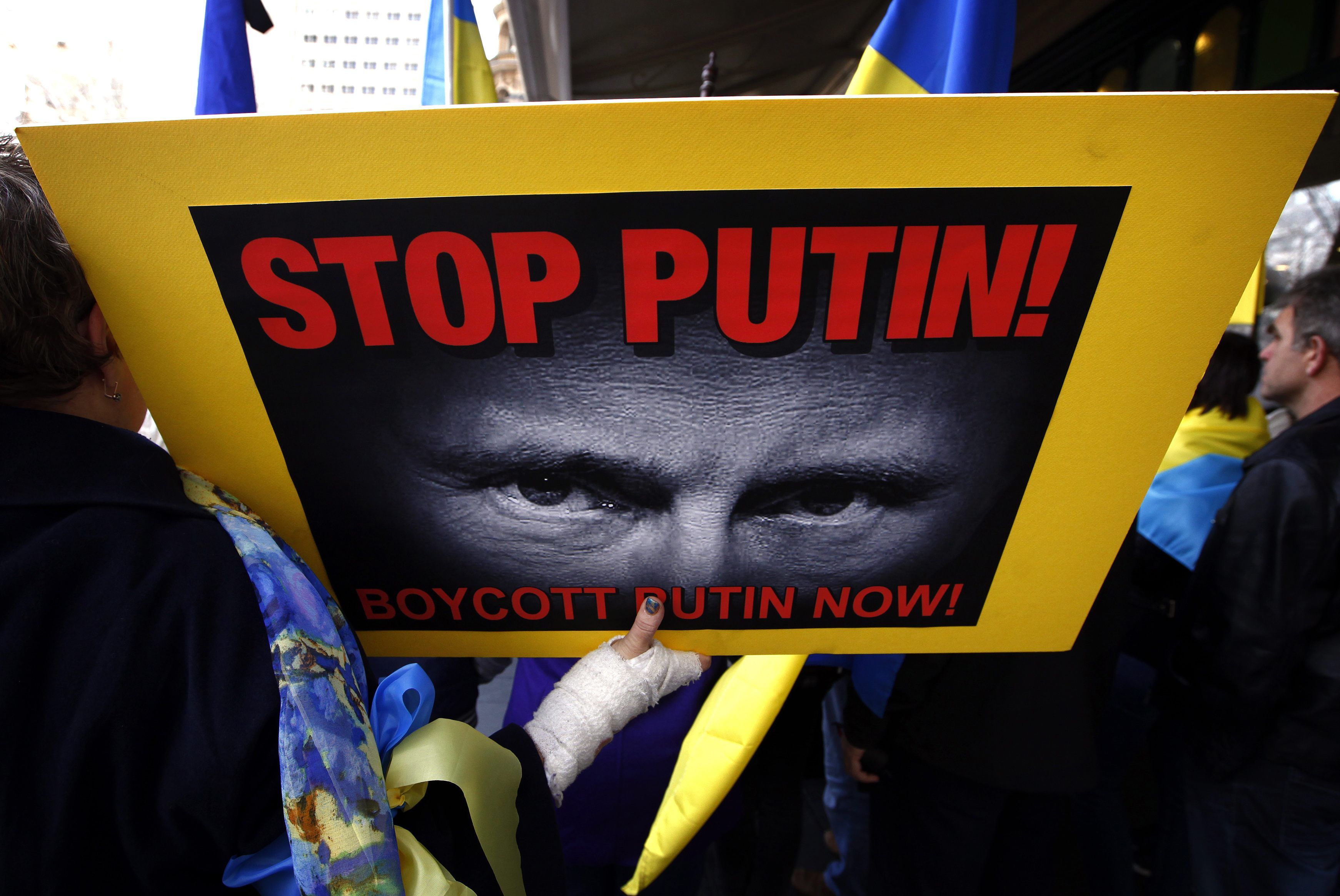 Members of the Australian Ukrainian community hold placards as they hold a rally in Sydney July 19, 2014, demanding that Russian President Vladimir Putin not be allowed to attend the G20 Leaders Summit in November. u00e2u20acu2022 Reuters pic