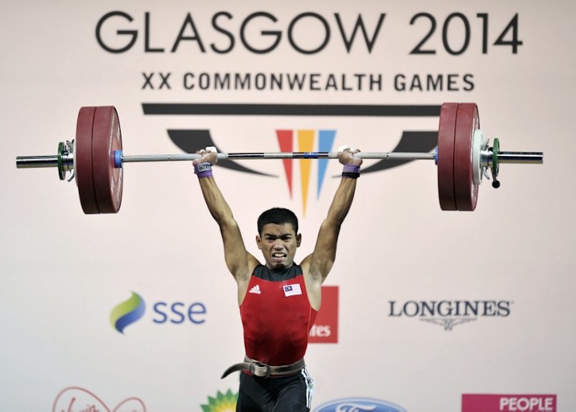Malaysiau00e2u20acu2122s silver medalist Mohd Zulhelmi Pisol makes a successful lift during the menu00e2u20acu2122s weightlifting 56kg class at the SECC Precinct during the 2014 Commonwealth Games in Glasgow July 24, 2014. u00e2u20acu201d AFP pic
