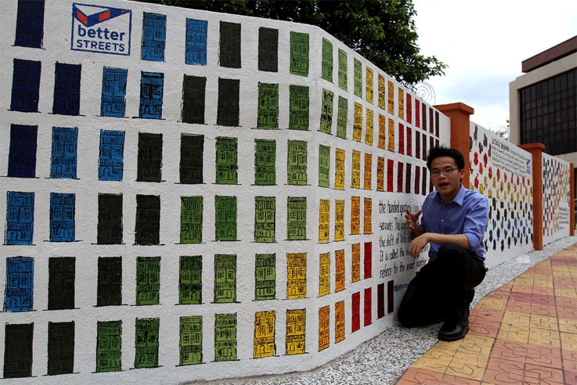 GSKL curator Shawn Keng explains the concept behind the community art project dubbed u00e2u20acu02dcBetterStreetsu00e2u20acu2122, in Brickfields, July 10, 2014. u00e2u20acu201d Picture by Yusof Mat Isa