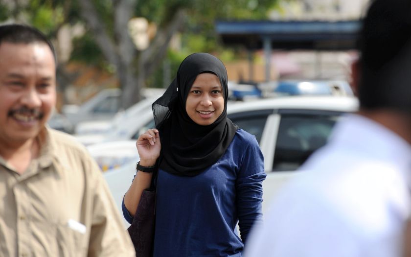 Siti Fairrah Ashykin Kamaruddin arrives at the Kuantan police headquarters to record her statement over the road rage incident, July 17, 2014. u00e2u20acu201d Bernama pic