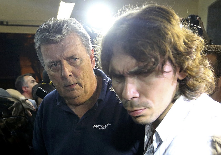 Ray Whelan (left), of Switzerland-based Match Services, arrives at a police station after being arrested in Rio de Janeiro July 7, 2014. u00e2u20acu201d Reuters pic