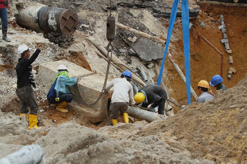Construction workers are seen repairing the sinkhole at Jalan Imbi in Kuala Lumpur, on July 3, 2014. u00e2u20acu201d Picture by Yusof Mat Isan