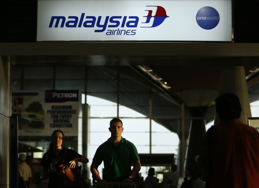 Travellers walk past Malaysia Airlines counters at the Kuala Lumpur International Airport in Sepang July 18, 2014. u00e2u20acu2022 Reuters pic