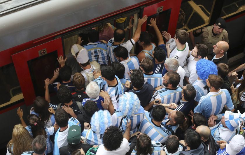 Argentina fans board a train at Luz Station to catch the 2014 World Cup semi-final match between Argentina and Netherlands, July 9, 2014. u00e2u20acu201d Reuters pic 