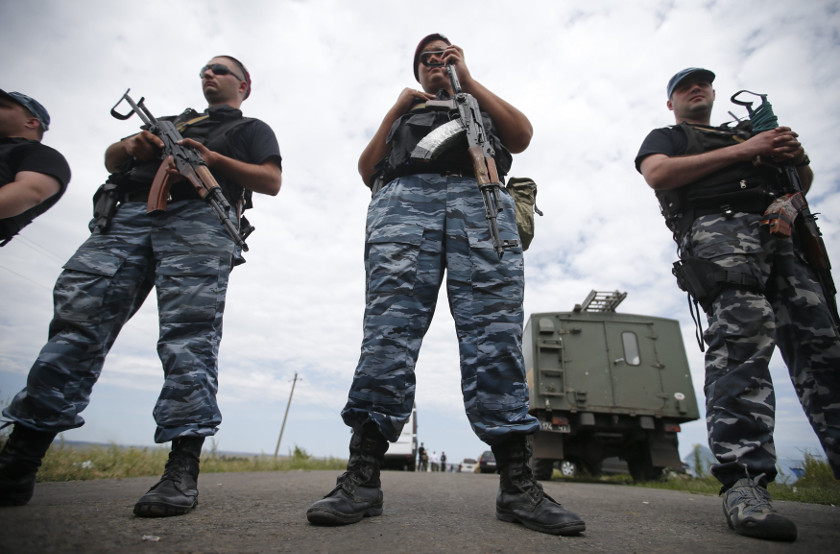 Armed pro-Russian separatists stand guard at a crash site of Malaysia Airlines Flight MH17, near the village of Hrabove, Donetsk region July 20, 2014. u00e2u20acu201d Reuters pic