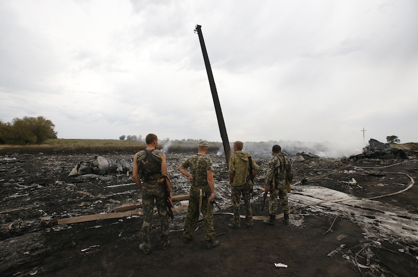 Armed pro-Russian separatists stand at the site of a Malaysia Airlines Boeing 777 plane crash near the settlement of Grabovo in the Donetsk region, July 17, 2014. u00e2u20acu201d Reuters pic