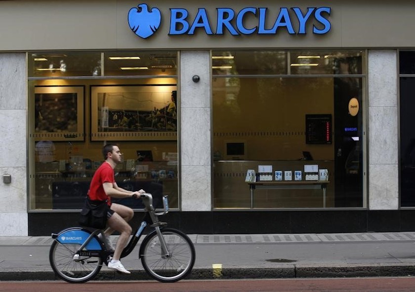 A man rides a bicycle past a Barclays bank in London August 5, 2010. u00e2u20acu201d Reuters pic