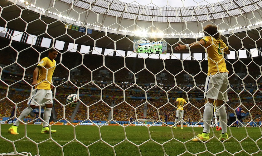 Brazil's players Thiago Silva (3), Paulinho (8) and Marcelo (6) react after Daley Blind of the Netherlands (5) scored his team's second goal during their 2014 World Cup third-place playoff at the Brasilia national stadium in Brasilia July 13, 2014. u00e2u20acu201du00c2u00a0R