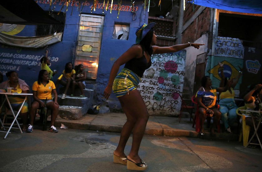 A Brazil fan reacts as she watches the 2014 World Cup semi-final between Brazil and Germany on television at Mangueira slum in Rio de Janeiro, July 9, 2014. u00e2u20acu201d Reuters pic