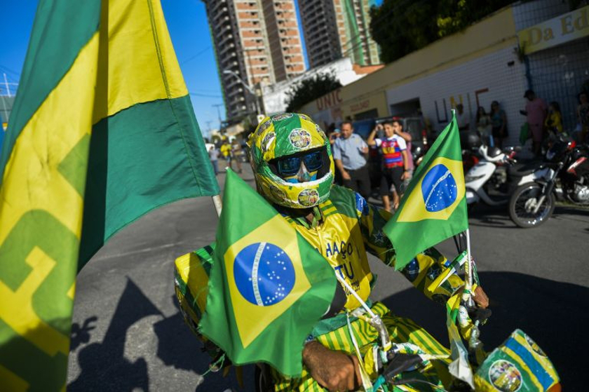 An enthusiastic Brazilian fan dressed himself and his motorcycle up in national colours to show his support for his national team. u00e2u20acu201d AFP pic