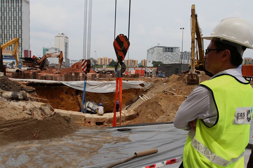 Construction workers are seen repairing the sinkhole at Jalan Imbi in Kuala Lumpur, on July 3, 2014. u00e2u20acu201d Picture by Yusof Mat Isa