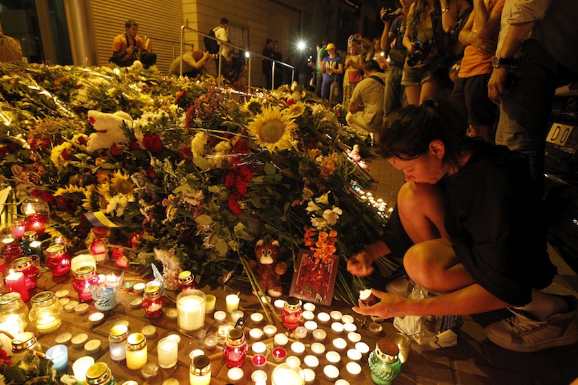 People bring flowers and candles to the Dutch embassy to commemorate the victims of the Malaysia Airlines Boeing 777 plane crash in Kiev, July 17, 2014. u00e2u20acu201d Reuters pic