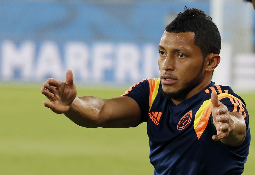 Colombia's national soccer team player Carlos Sanchez stretches during a training session a day before their World Cup match against Japan, at the Arena Pantanal in Cuiaba, June 23, 2014. u00e2u20acu201d Reuters pic