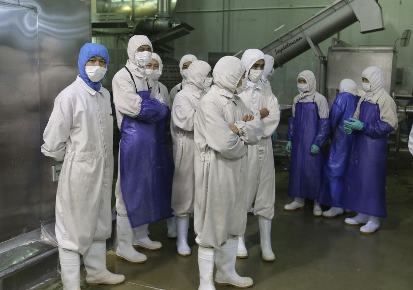 Employees stand during a seizure conducted by officers from the Shanghai Food and Drug Administration, at the Husi Food factory in Shanghai, July 20, 2014. u00e2u20acu201d Reuters pic