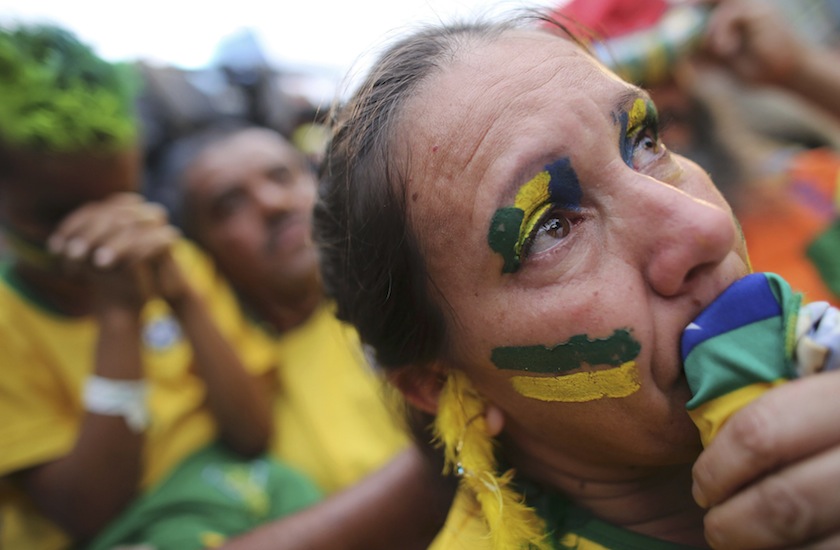A Brazilian fan cries as she watches the 2014 World Cup semi-final match between Brazil and Germany in Sao Paulo July 9, 2014.u00c2u00a0u00e2u20acu201d Reuters pic