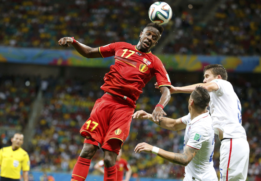 Belgium's Divock Origi jumps for the ball next to Geoff Cameron and Matt Besler (right) of the US during their 2014 World Cup round of 16 game at the Fonte Nova arena in Salvador July 1, 2014. u00e2u20acu201d Reuters pic