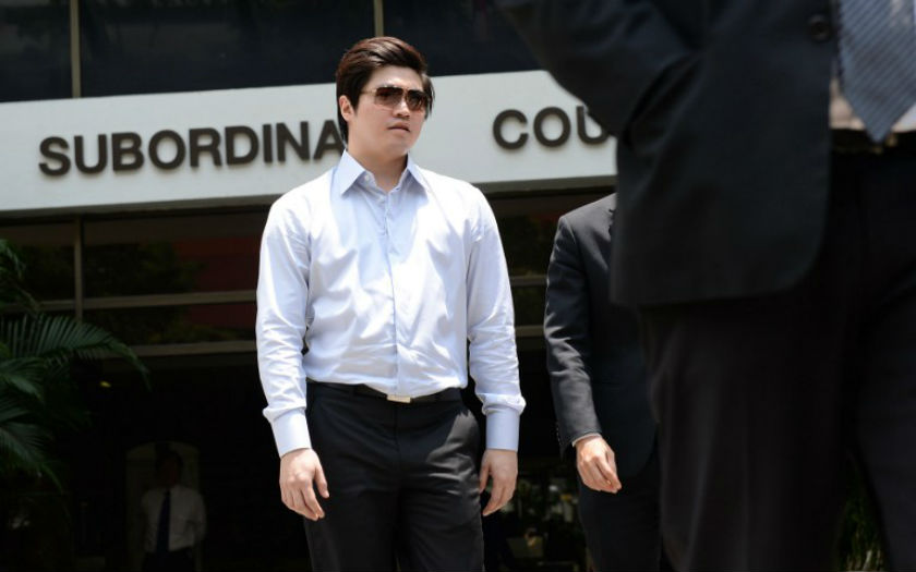 Singaporean businessman Eric Ding Si Yang leaves a district court for a lunch break in Singapore on August 28, 2013. u00e2u20acu201d AFP pic
