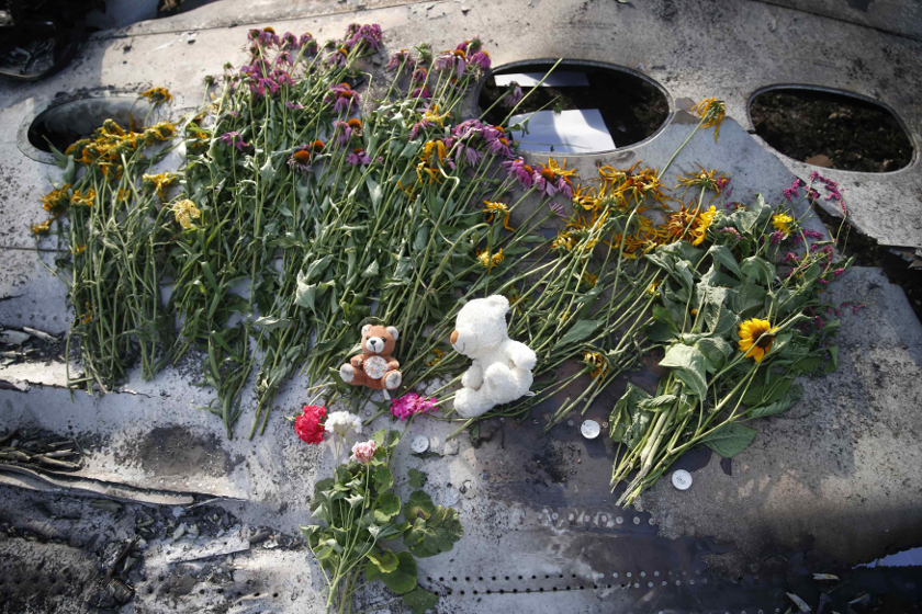 Flowers and mementos lie on wreckage at the crash site of Malaysia Airlines Flight MH17, near the settlement of Grabovo in the Donetsk region July 19, 2014. u00e2u20acu201d Reuters pic