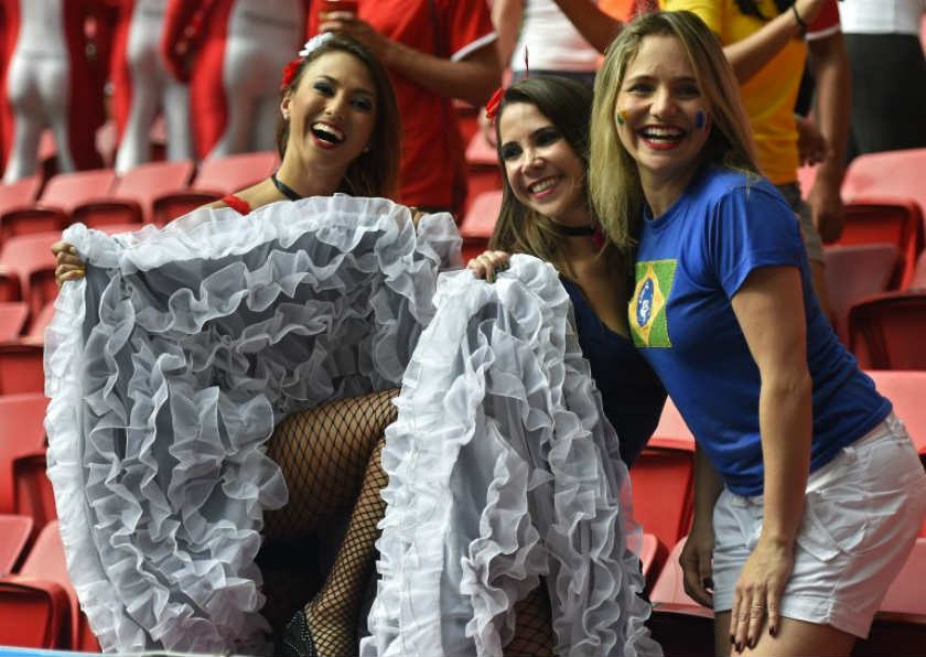 Three Frenchwomen decided to cheer on their team with the can can. u00e2u20acu201d AFP pic
