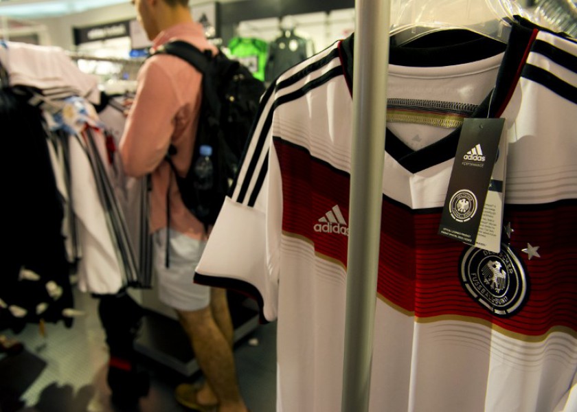 Jerseys of Germanyu00e2u20acu2122s national football team by German sportswear company Adidas are for sale at a sports shop in Berlin on July 10, 2014, three days ahead of the 2014 FIFA World Cup final match between Germany and Argentina. u00e2u20acu201d AFP pic