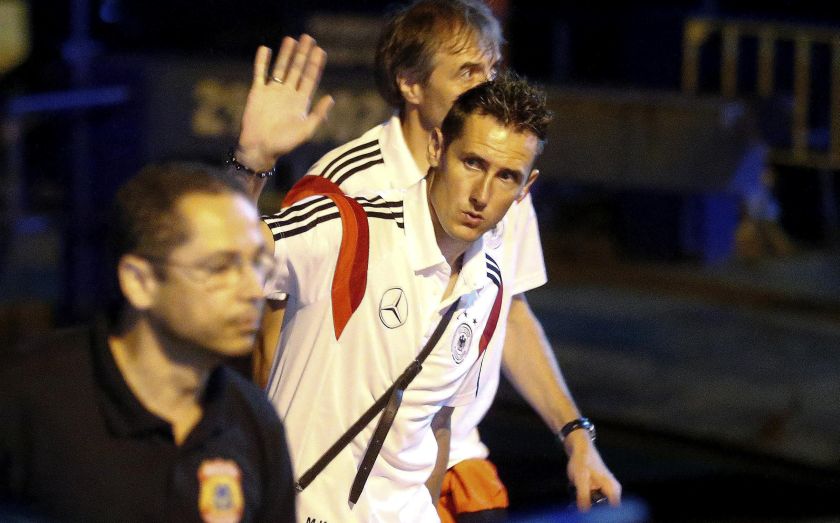 Germany's national football team player Miroslav Klose (centre) waves as he leaves a ferry boat in the town of Santa Cruz Cabralia, north of Porto Seguro, July 11, 2014. u00e2u20acu2022 Reuters pic
