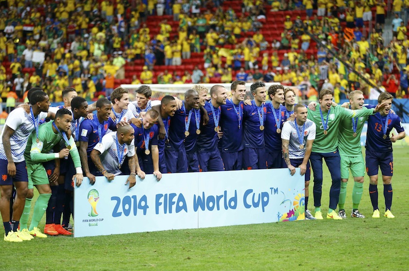 The Netherlands team poses for pictures after winning their 2014 World Cup third-place playoff against Brazil at the Brasilia national stadium in Brasilia July 13, 2014. u00e2u20acu201du00c2u00a0Reuters pic