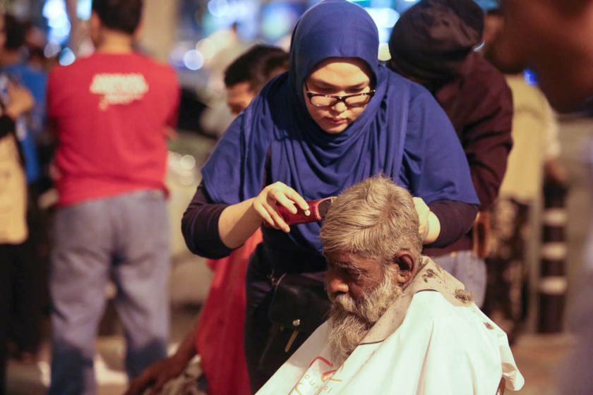 People get free haircuts at the Pertiwi soup kitchen, June 23, 2014. — PIcture by Choo Choy May