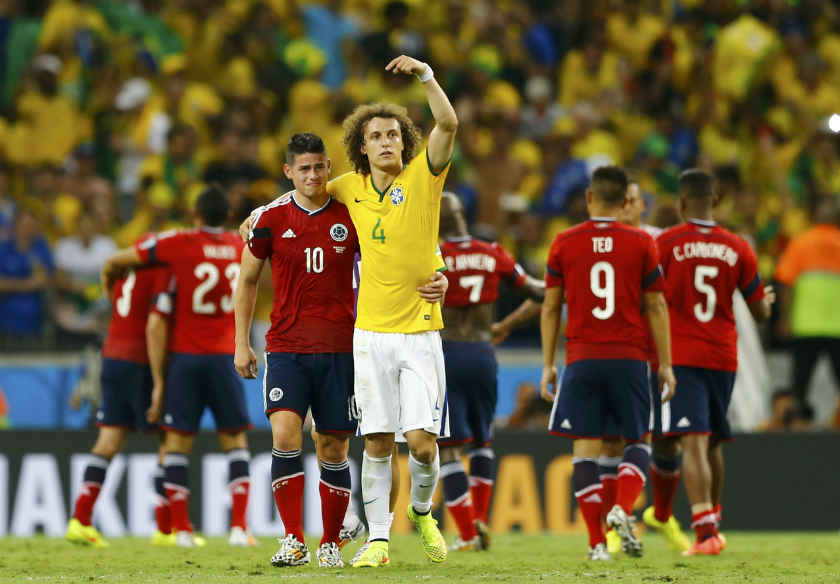 Brazil's David Luiz (4) gestures at Colombia's James Rodriguez (10) as he tells the spectators to applaud him after their 2014 World Cup quarter-finals at the Castelao arena in Fortaleza July 4, 2014. u00e2u20acu201d Reuters pic