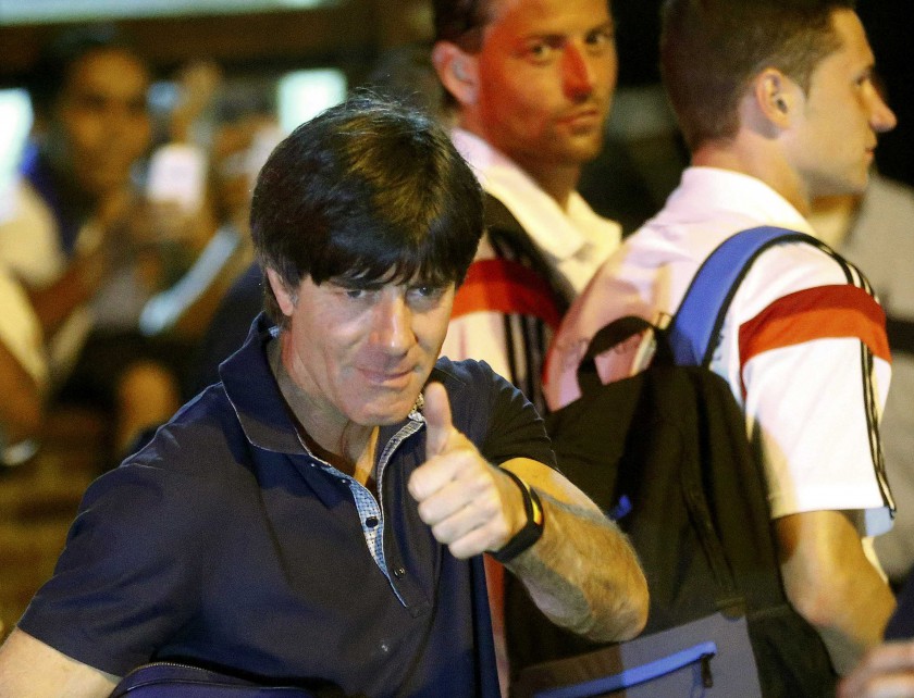 Germanyu00e2u20acu2122s national football team coach Joachim Loew (left) gives a thumbs-up before boarding a bus in the town of Santa Cruz Cabralia, north of Porto Seguro, July 11, 2014. u00e2u20acu201d Reuters pic