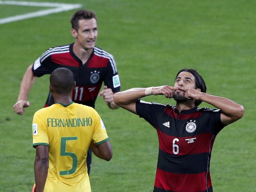 Germany's Sami Khedira (right) celebrates past his teammate Miroslav Klose and Brazil's Fernandinho after scoring his team's fifth goal during their 2014 World Cup semi-finals at the Mineirao stadium in Belo Horizonte July 9, 2014.u00c2u00a0u00e2u20acu201d Reuters pic