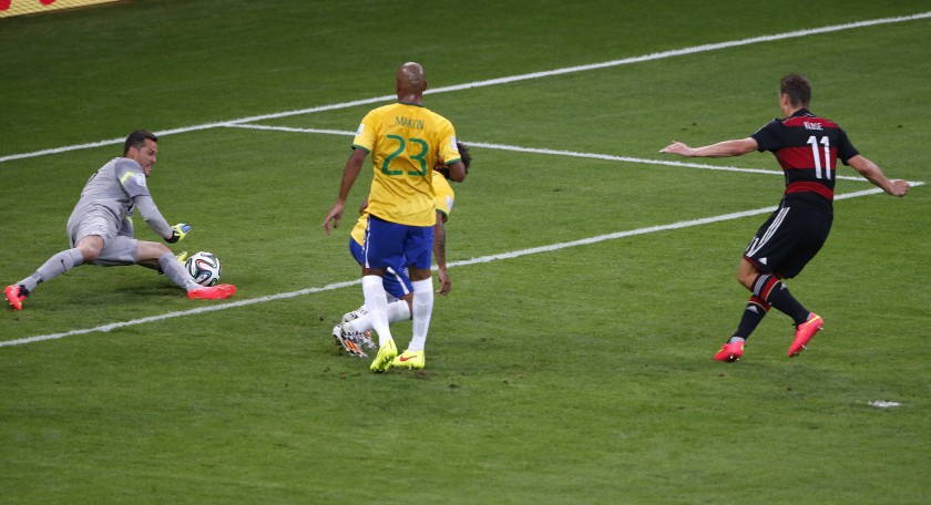 Germanyu00e2u20acu2122s Miroslav Klose (right) shoots to score his teamu00e2u20acu2122s second goal against Brazil during their World Cup semi-finals in July 8, 2014. Klose scored a record 16 goals at the World Cup to surpass the record set by former Brazil forward Ronaldo. u00e2u20acu201d 