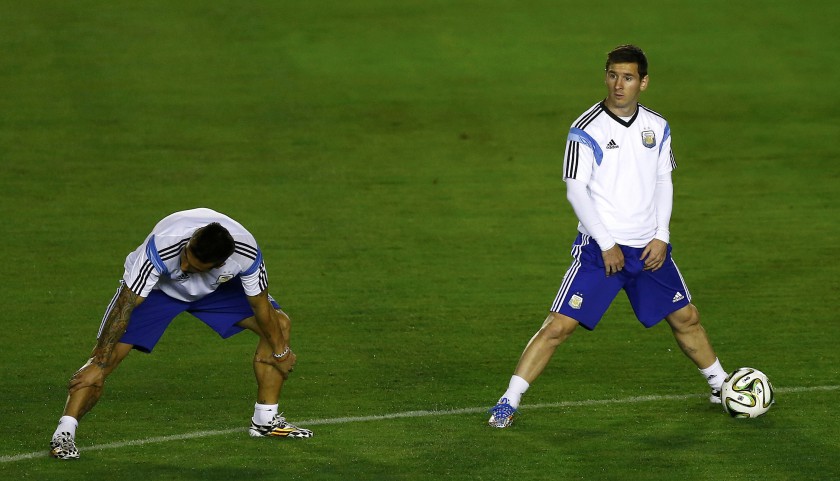 Argentinau00e2u20acu2122s national football team player Lionel Messi (right) stretches with teammates during a training session in Rio de Janeiro July 12, 2014, ahead of their World Cup Final match against Germany. u00e2u20acu201d Reuters pic