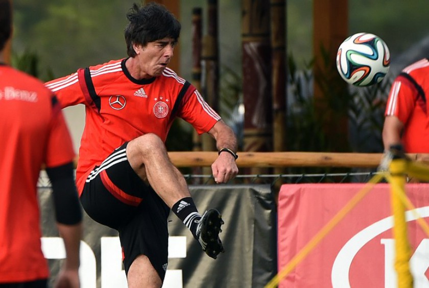 Germanyu00e2u20acu2122s coach Joachim Loew controls the ball during a training session of their national football team in Santo Andre, Brazil on July 10, 2014 ahead of the final match against Argentina. u00e2u20acu201d AFP pic