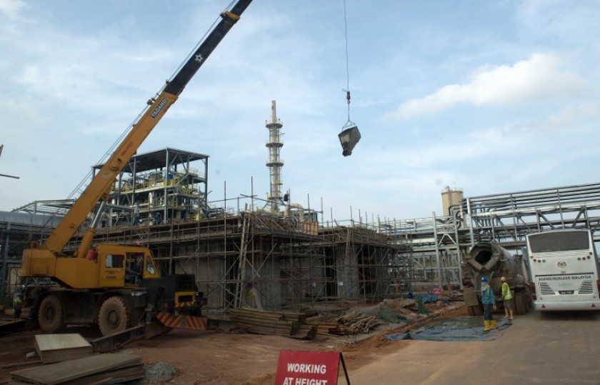 File picture shows labourers working at an under-construction Lynas plant in Gebeng, some 270 kilometres east of Kuala Lumpur on April 19, 2012. u00e2u20acu201d AFP picn