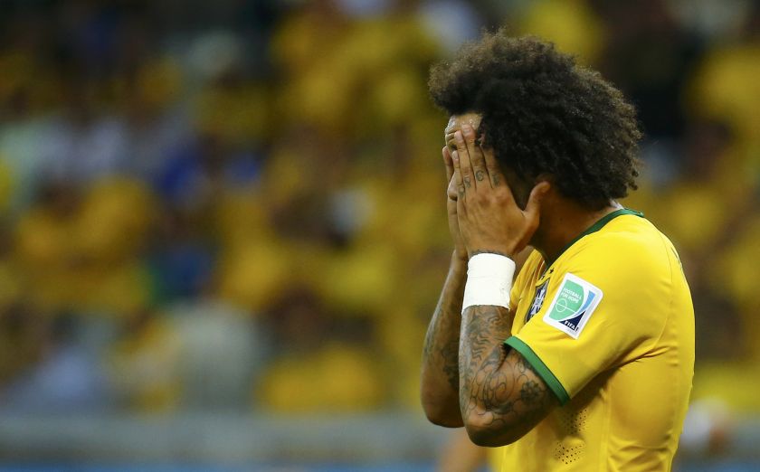 Brazil's Marcelo reacts after his team conceded the seventh goal to Germany during their 2014 World Cup semi-finals at the Mineirao stadium in Belo Horizonte July 9, 2014.  u00e2u20acu201d Reuters pic