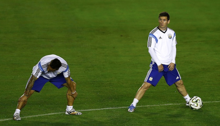 Argentina's national team player Lionel Messi stretches with teammates during a training session in Rio de Janeiro July 13, 2014, ahead of their 2014 World Cup Final match against Germany on July 14.u00c2u00a0u00e2u20acu201du00c2u00a0Reuters pic