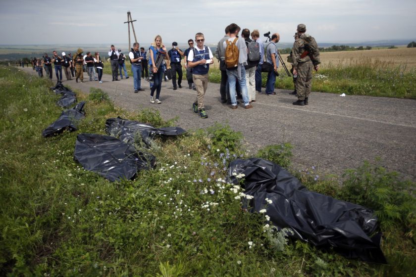 Organisation for Security and Cooperation in Europe (OSCE) monitors walk at the crash site of Malaysia Airlines Flight MH17, near the settlement of Grabovo in the Donetsk region July 19, 2014. u00e2u20acu2022 Reuters pic