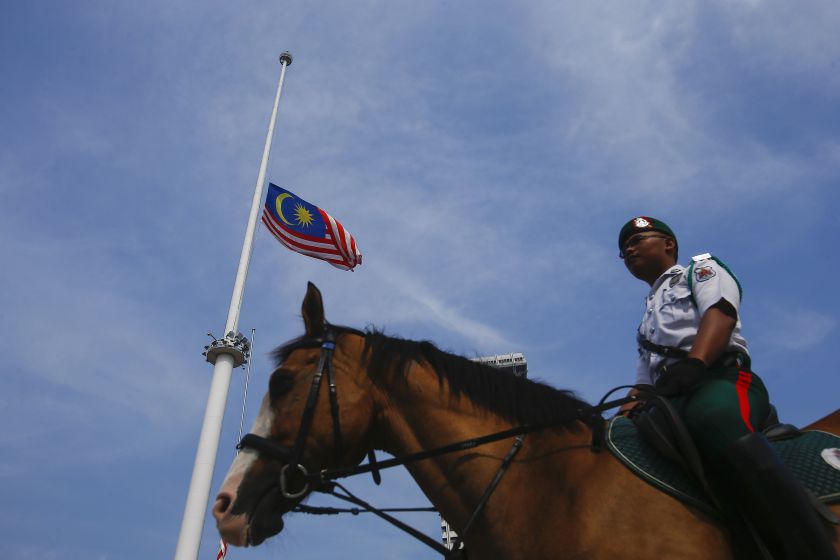 The national flag is pictured flying at half-mast to mourn the passengers of Malaysian Airlines Flight MH17, at Dataran Merdeka in Kuala Lumpur, July 19, 2014. u00e2u20acu201d Reuters pic