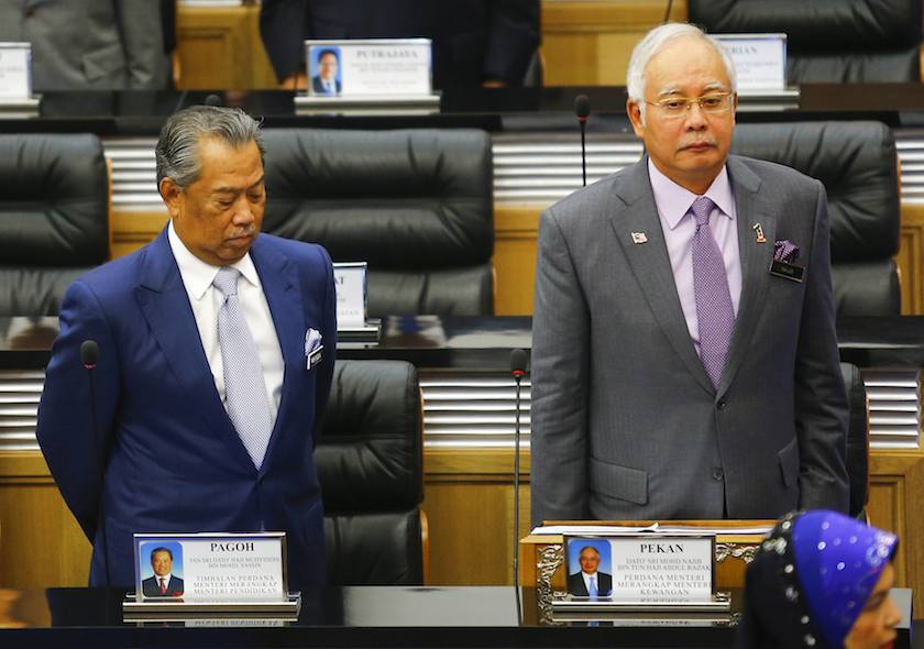 Prime Minister Datuk Najib Razak and Deputy Prime Minister Tan Sri Muhyiddin Yassin observe a moment of silence before the start of a special parliament session convened to discuss the MH17 tragedy in Kuala Lumpur July 23, 2014. u00e2u20acu201d Reuters pic