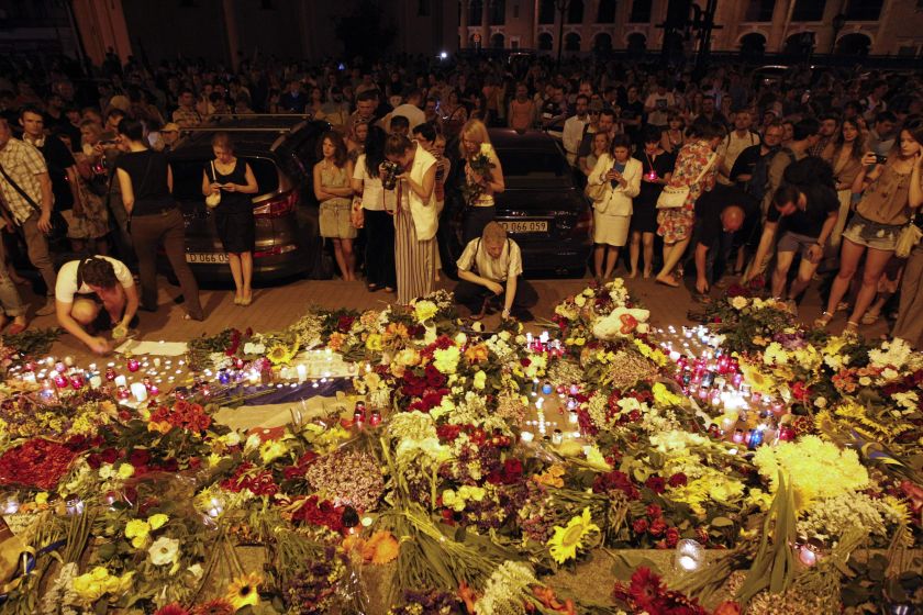 People leave candles and flowers at the Dutch embassy for victims of Malaysia Airlines MH17, which crashed in eastern Ukraine, in Kiev July 17, 2014. u00e2u20acu2022 Reuters pic