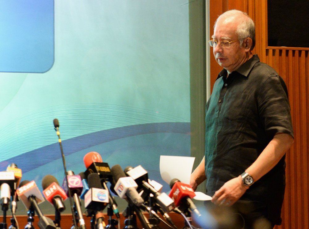 Malaysian Prime Minister Datuk Seri  Najib Razak addresses reporters at the Sama-Sama Hotel near Kuala Lumpur International Airport in Sepang July 18, 2014. u00e2u20acu201d Picture by Choo Choi May