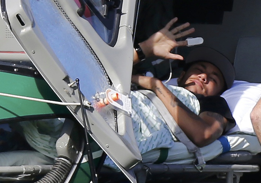 Injured Brazilian national team player Neymar waves as he waits to be airlifted home from Brazil's training camp inTeresopolis, near Rio de Janeiro, July 6, u00e2u20acu201d Reuters pic