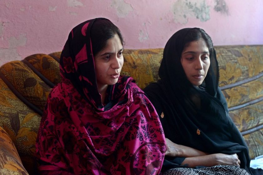 In this photograph taken on May 8, 2014, sisters Zunera (left) and Shaista, who were trapped in the sex trafficking trade by a neighbour and held hostage in a brothel in Dubai, speak during an interview with AFP in Faisalabad. u00e2u20acu201d AFP pic