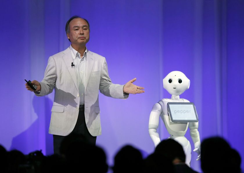 Masayoshi Son, president of Japan's SoftBank, introduces humanoid robot 'Pepper' during a press conference in Tokyo June 5, 2014. u00e2u20acu201d AFP pic